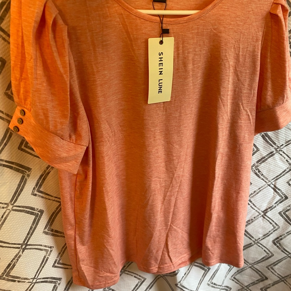 Women tangerine color soft short sleeve shirt w button detailing